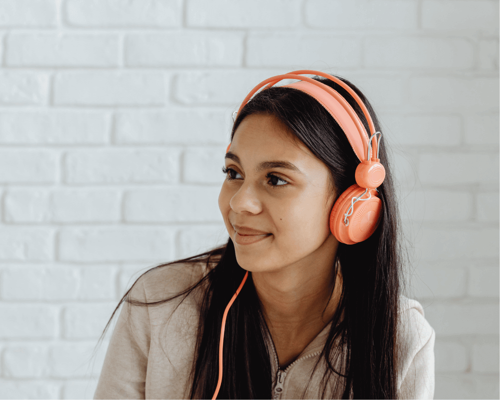 Young girl wearing headphones for auditory testing