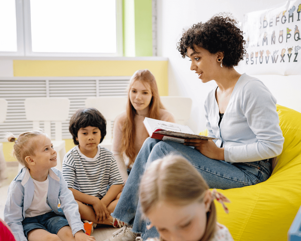 Teacher reading to children in a classroom
